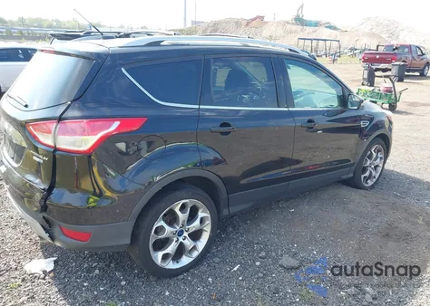 2016 Ford Escape Titanium z USA, uszkodzony, nr VIN 1FMCU9J90GUC16559